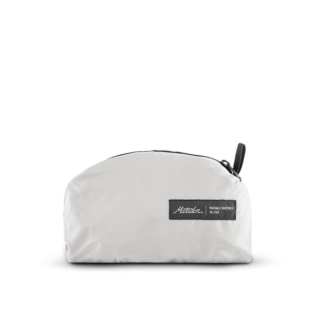 packed up arctic white backpack on white background