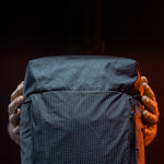 detail view of edx light backpack materials on dark studio background