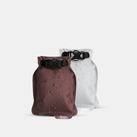 Garnet and arctic white Flatpak soap bar cases on light gray background