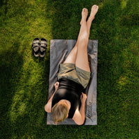 Top view of woman laying on Pocket Blanket Mini on shady green grash