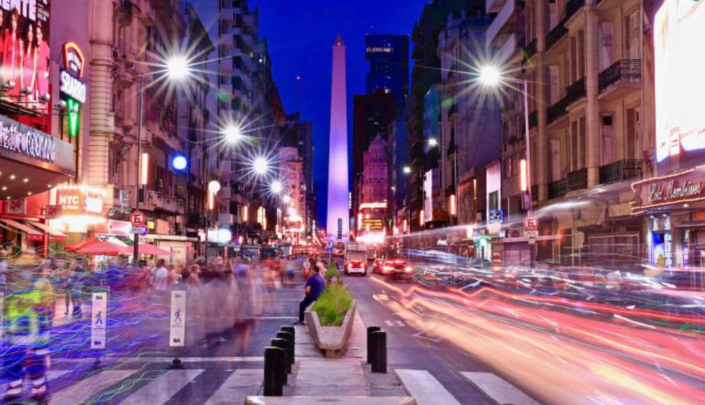 Lively nighttime street in buenos aires