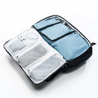 Open clamshell of black globerider35, revealing slate blue packing cubes.