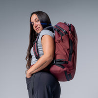 side view of a woman wearing garnet globerider35 on light gray background