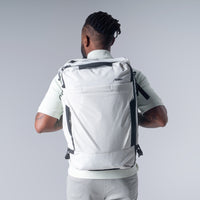 back view of a man wearing arctic white globerider35 on light gray background