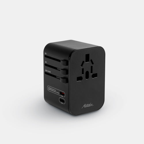 3/4 view of travel adapter on light gray background