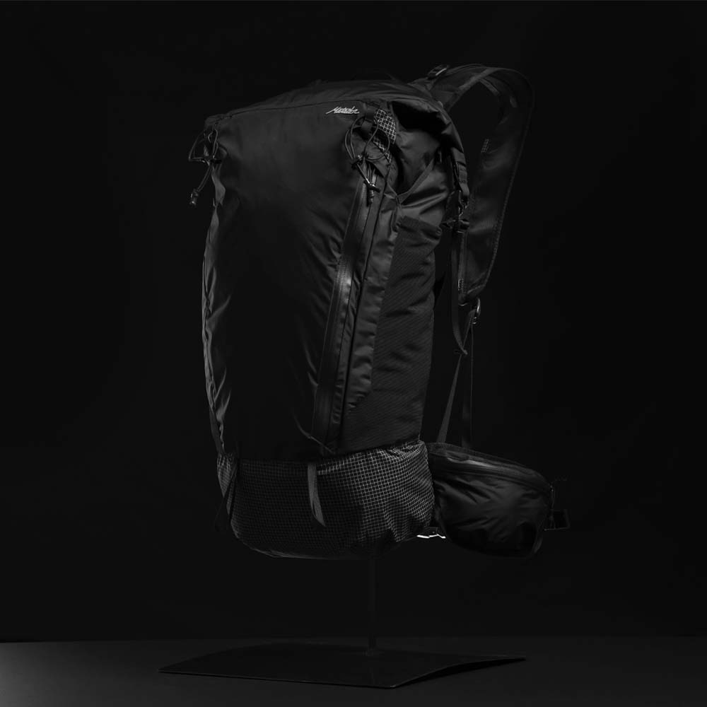 3/4 view of backpack on black background