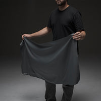 Man holding open towel on black